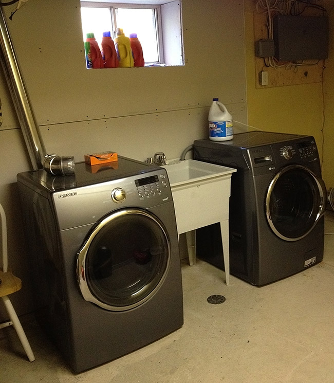 unfinished laundry room in basement