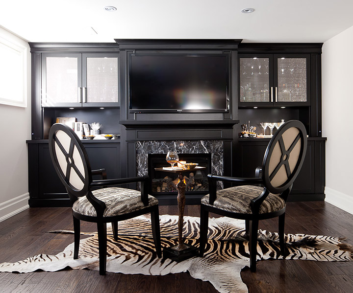 Entertainment unit with mini-bar, home theatre and fireplace.