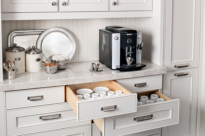 Custom kitchen cabinetry for storing coffee and tea supplies.