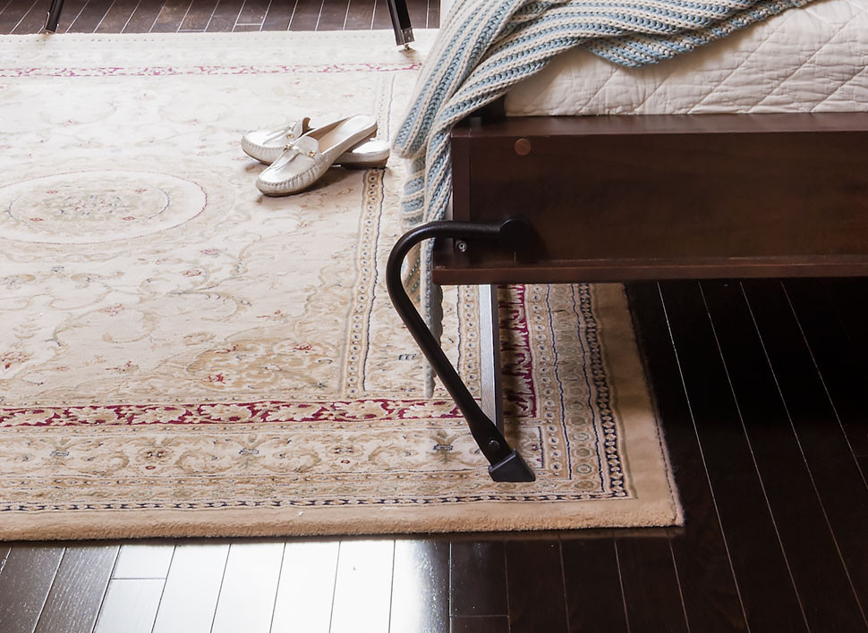 Organized Interiors wall bed feet angle in under the bed so you don't stub your toes.