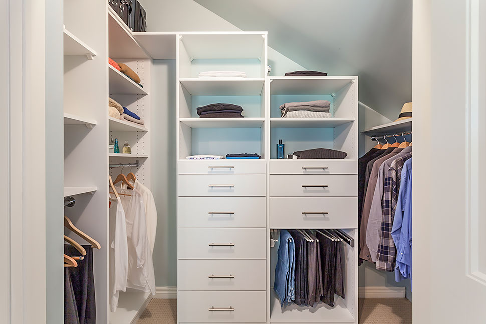 Custom closet for master bedroom with pitched roof line.