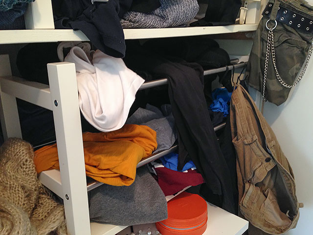 Messy bedroom closet.