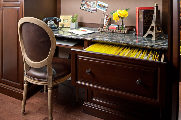 Eliminate home office clutter with a filing cabinet and a clean desk.