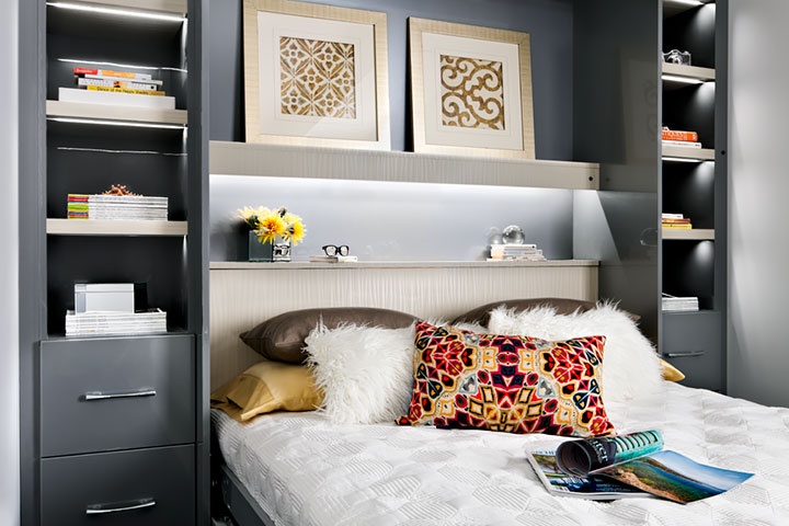 pillows on bed with surrounding storage