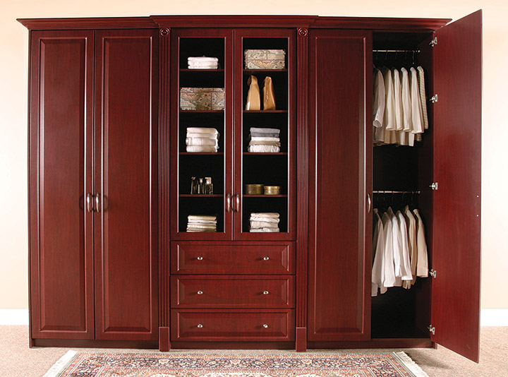 Dark wood wardrobe with plenty of storage space.