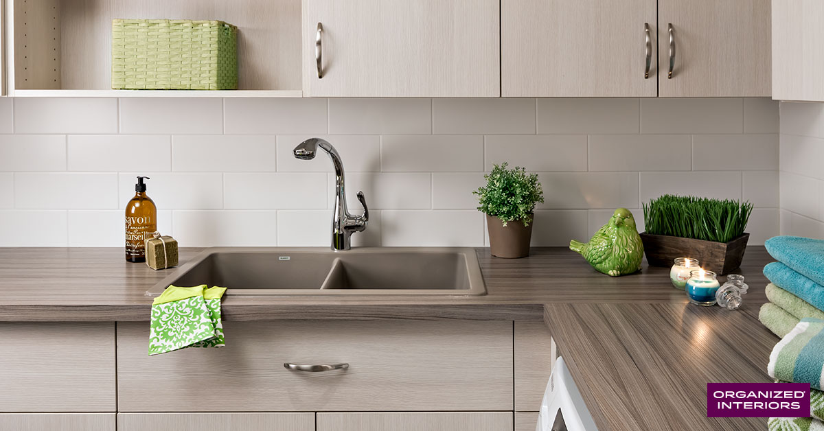 laundry room sink, countertop, custom cabinetry, green gloves, folded towels