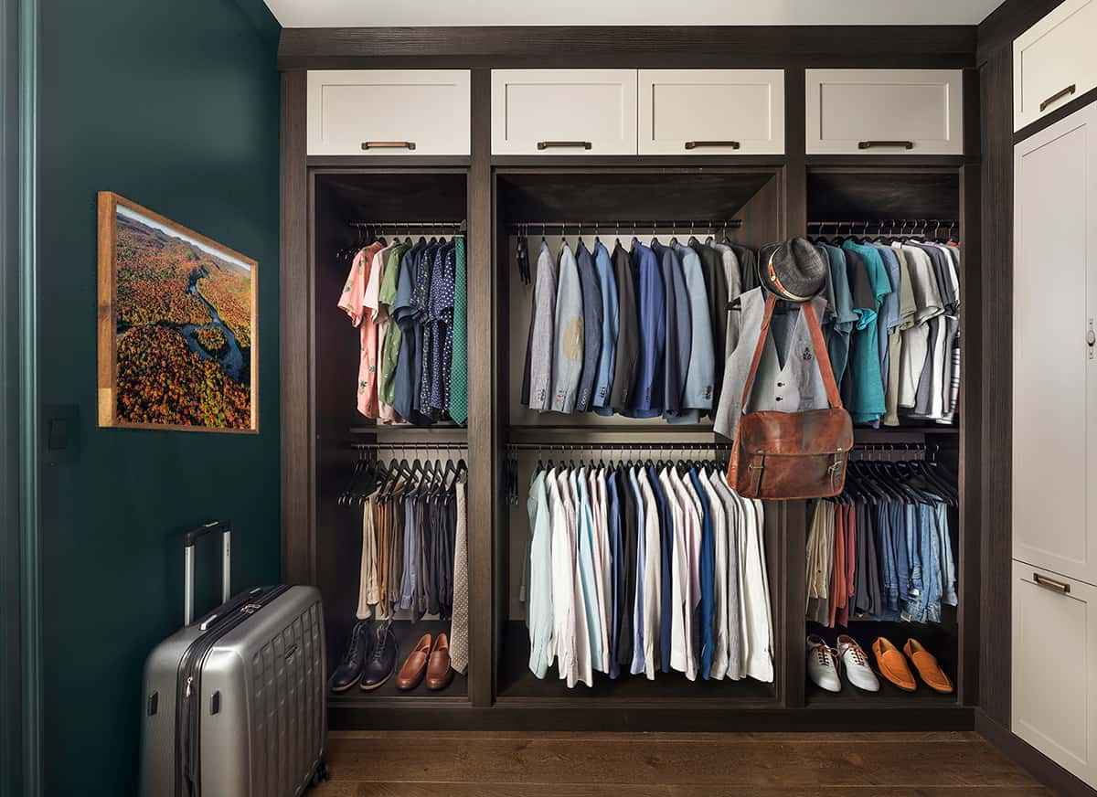 walk-in closet with green walls