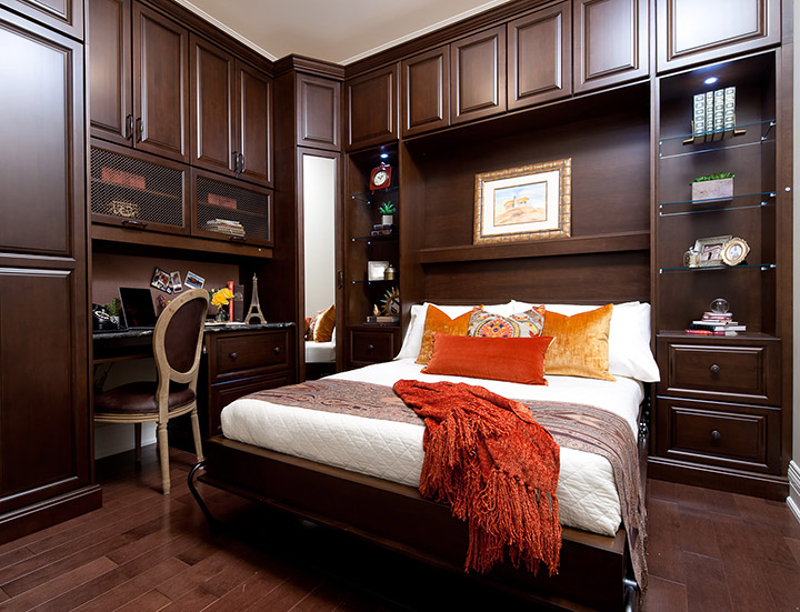 Custom bedroom Murphy bed in chocolate pear by Organized Interiors. holiday home organization tips wall bed