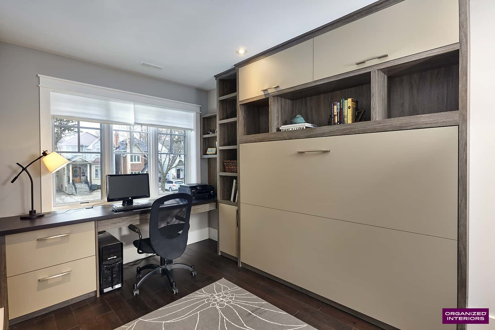 Small bedroom with Murphy bed hidden away in the built-in cabinetry. Computer, desk, and chair, custom built-ins.