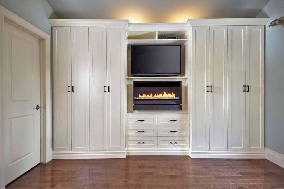 built-in wall unit with tv, fireplace, wardrobes
