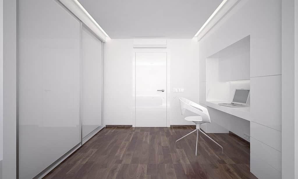 White cloffice with desk, chair, wardrobe closet.