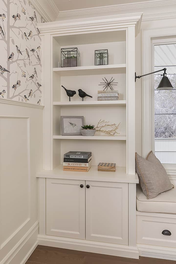 white built-in storage in a den