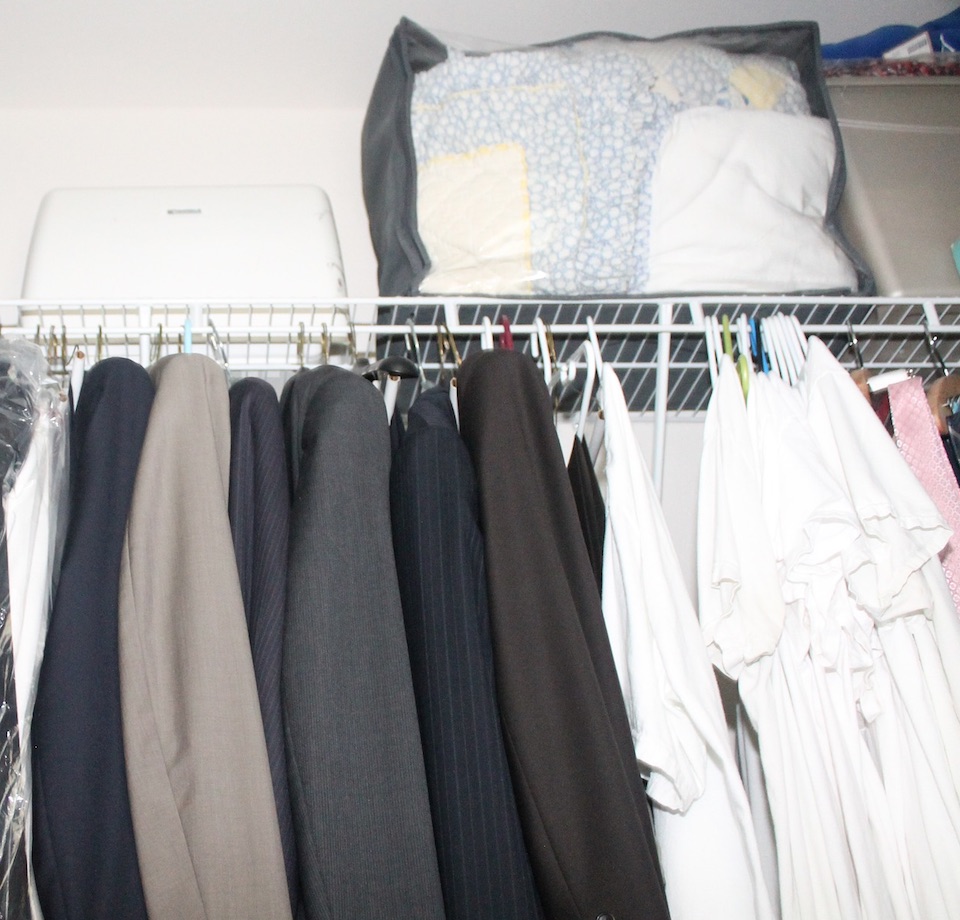 wire closet shelving with hanging clothes