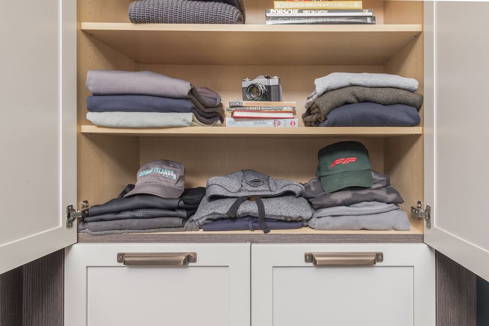 folded clothes in organized closet