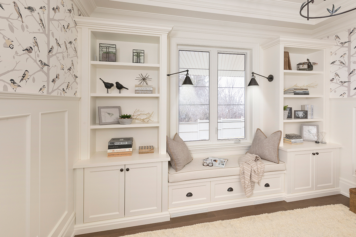 white built-ins organized den