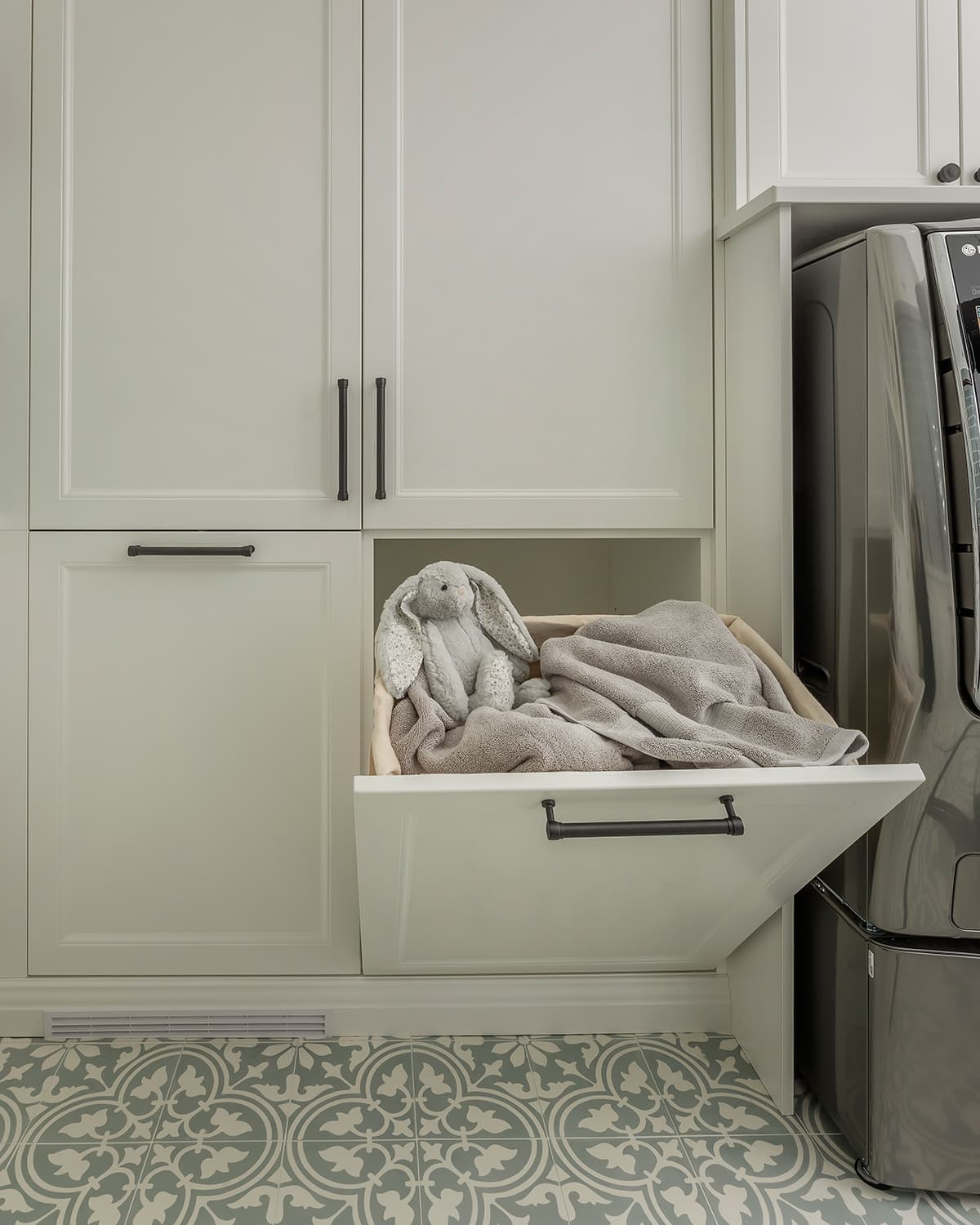 open laundry hamper white cabinetry