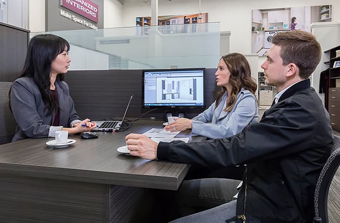 two people discussing closet design project