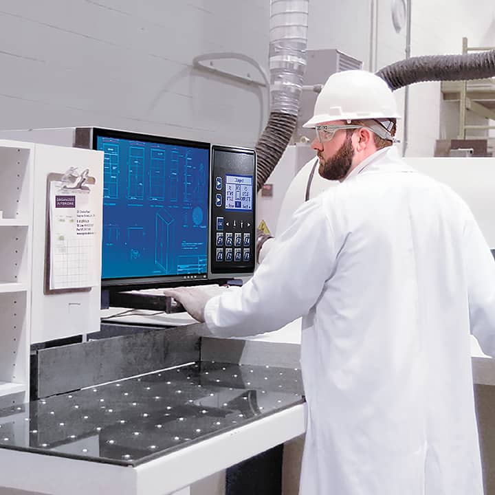 man in lab coat and white hard hat