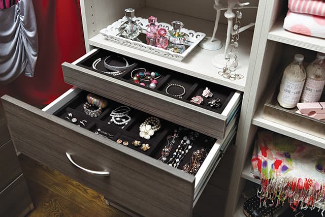 nested jewellery drawers, open, in a closet