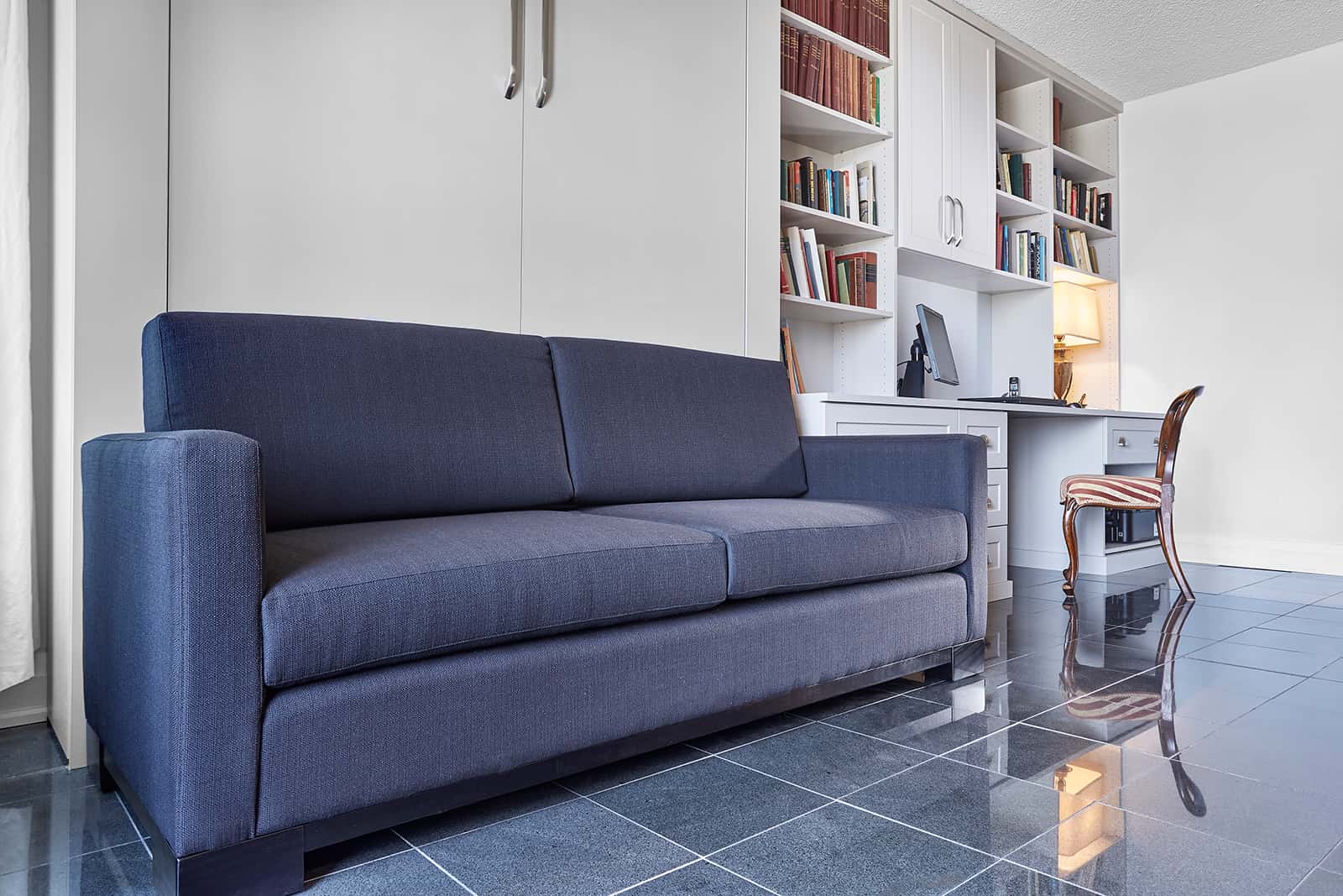 blue sofa Murphy bed in closed position, Toronto condo.