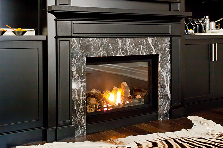 fireplace below TV set