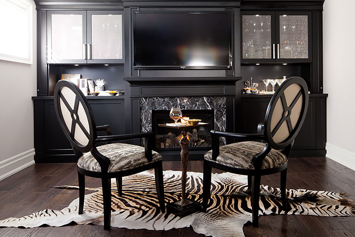 fireplace in entertainment centre wth table and two chairs