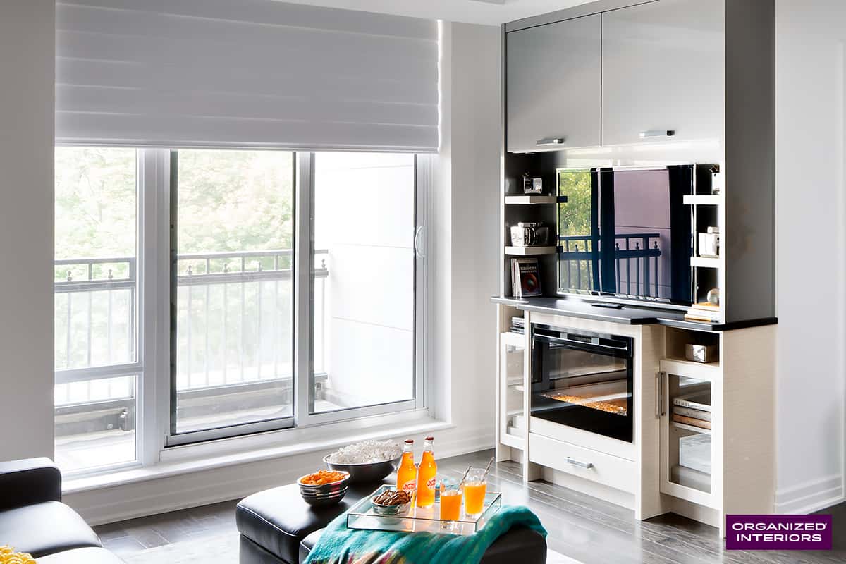 entertainment centre with tv and wall to wall built-in storage